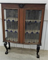 Curio cabinet with leaded glass doors -