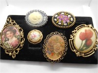 (6) VINTAGE CAMEO BROOCHES.