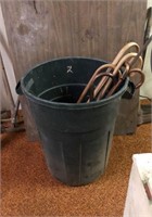 Garbage can with wooden canes