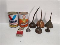 group of oil cans, dippers, and tins
