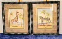 two framed giraffe and zebra pictures