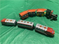 PAIR OF METAL AND PLASTIC WIND UP TOY TRAINS