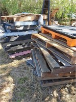 Stacks of timber & plastic pallets