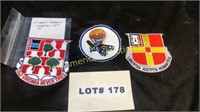 Three military patches