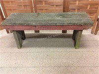 Red and green barn wood bench