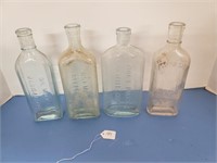4 EMBOSSED APOTHECARY BOTTLES