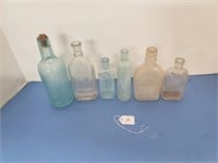 6 EMBOSSED APOTHECARY BOTTLES