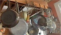 Kitchen gadgets hanging over the stove - includes