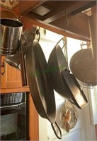 Cookware on the hanging rack - includes a wok,