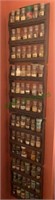 Four wooden spice racks with the spice jars and
