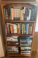 4 shelf bookcase with the books including