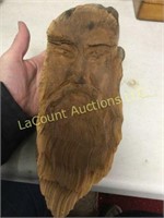 old wood carved man face beard