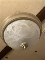 Swirled frosted glass covered ceiling fixture