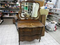 Antique dresser w/beveled glass mirror.