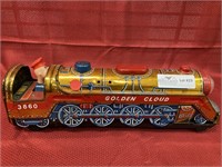 Toy metal golden cloud train.