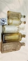 5 old glass bottles