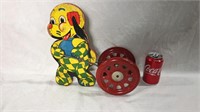 Vintage pull toy rings a bell as it rolls