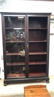 Tall mahogany bookcase missing one glass