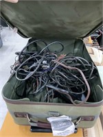 Case full of electric cords and mic stands