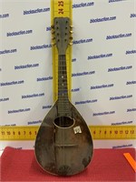 Antique mandolin has damage