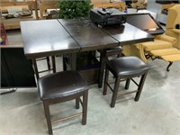 High top kitchen table with four bar stools