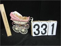 Vintage Baby doll in metal carriage