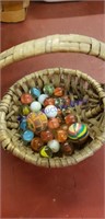 Basket of vintage marbles