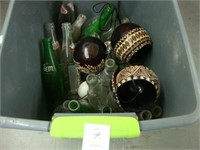Tub containing various old pop bottles.