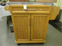 Rolling kitchen island with stainless top.