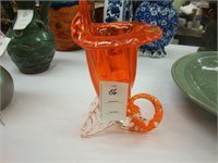 Orange art glass cornucopia vase.