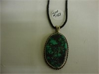 Turquoise and silver pendant.