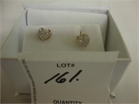 14 Kt Diamond heart earrings.