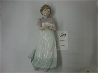 Lladro Figure of young girl holding a piece of
