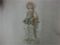 Lladro Figurine of a farm boy.