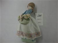 Lladro figurine of a young girl with a basket of