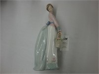 Lladro figurine of a young Woman holding a basket