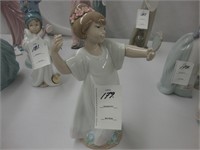 Lladro figurine of a young girl holding a hand