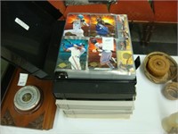 Folder containing baseball cards along with four