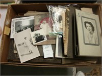 Box containing various old photographs.