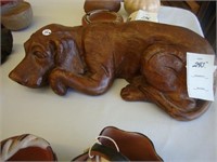 Figure of a hound dog carved from a piece of