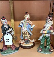 Three clown figurines