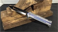 The thin blue line thumb assist knife