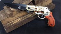 Gold w/wood handle pistol thumb assist knife