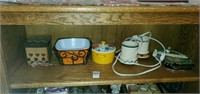 Shelf of containers,  small votive warmer