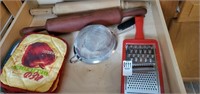 Drawer of rolling pins,  pot holders, grater &