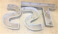 Three Metal and Plastic Letters
