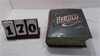 The Herold book tin