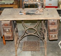ANTIQUE NEW HOME TREADLE SEWING MACHINE & CABINET