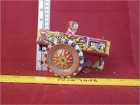 "Queen of the Campus" wind-up tin toy