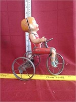 Tin kid on tricycle toy